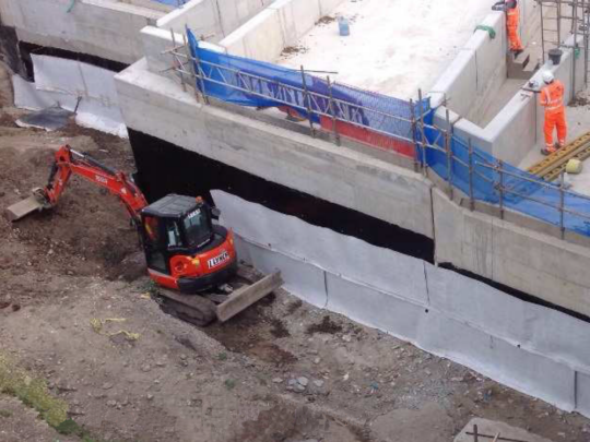 Deckdrain replaces concrete block drainage in tight work spaces
