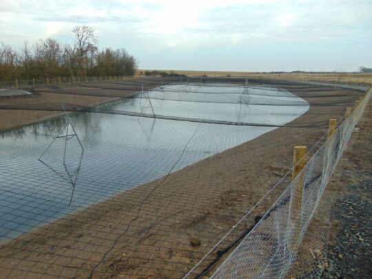 Completed SuDS pond controlling groundwater
