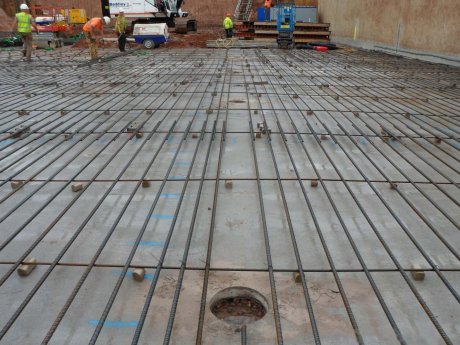 Reinforced floor slab preparation showing a valve position
