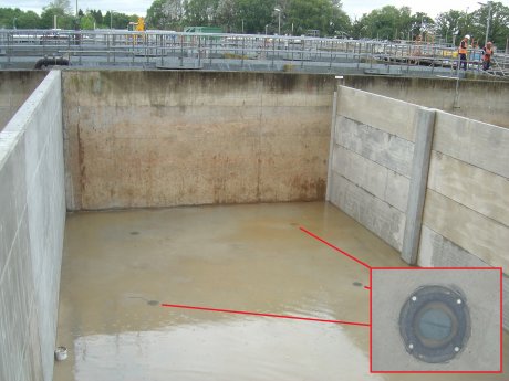 The finished floor slab with non-return valves for groundwater pressure relief when the tanks are empty
