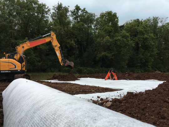 Backfill operation followed immediately behind the geotextile filter jointing

