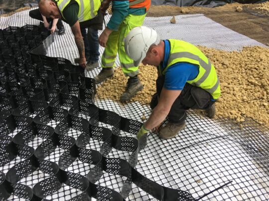 Abweb geocell expanded and attached to Abgrid using Abfix Ties placed over soft soil areas. Pinning was not allowed as this overlays the Terrex SNW protector geotextile on top of the geomembrane.
